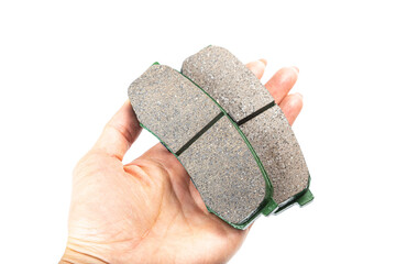 Obraz premium brake pad in hand, car spare parts isolated on white