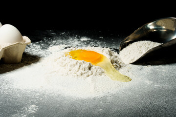 Dough preparation process on a dark background.