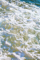 Sea waves and foam near cruise ship