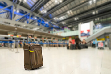 Brown color trolley travel bag or luggage at international airport front of check in counter