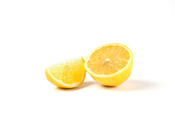 A slice and half lemons isolated on white background