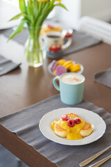 Delicious and beautiful breakfast for family on wooden table.