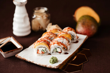 Shrimp, avocado and mango sushi set beautifully served in a restaurant