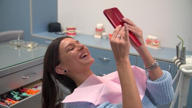 Woman at the dentist after hygiene procedure