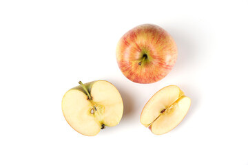 Red apple whole and sliced on white background