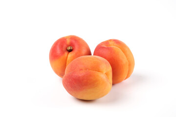 Three peaches isolated on white background macro view