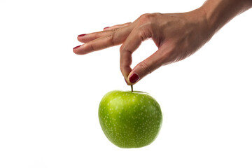 Woman hand holding single apple on white background