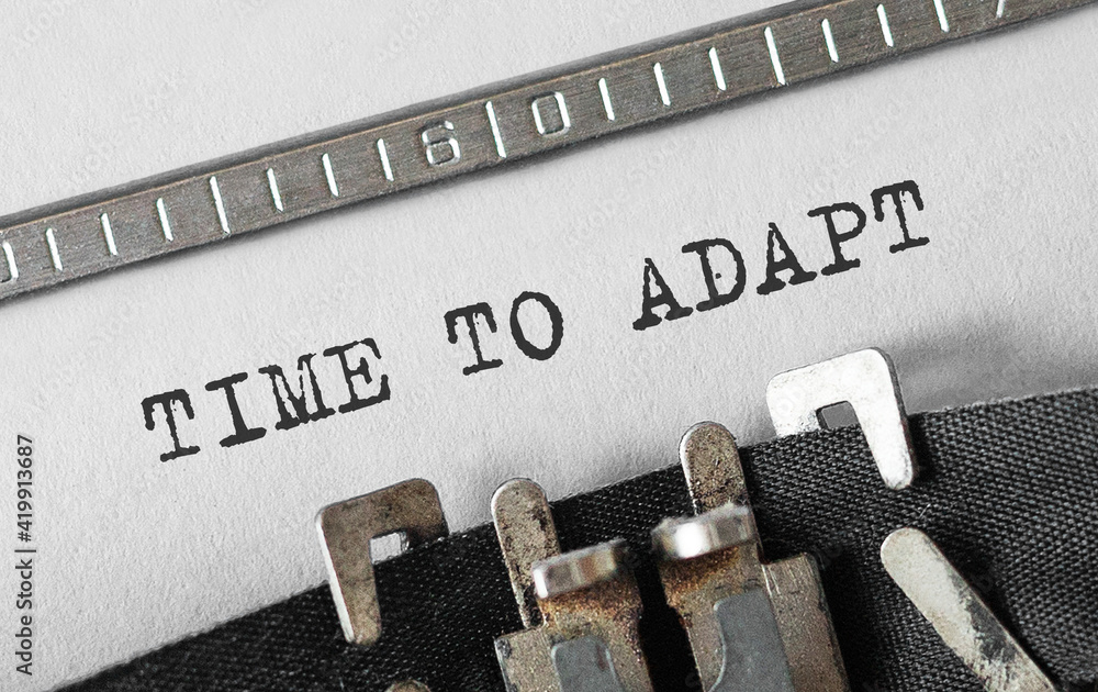 Poster text time to adapt typed on retro typewriter