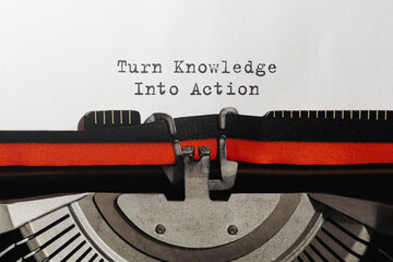 Text Turn Knowledge Into Action typed on retro typewriter