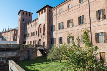Fototapeta na wymiar Castle with moat and bridge. Vercelli city, Italy. Currently the seat of the Palace of Justice as written above the entrance, it dates back to the 13th century