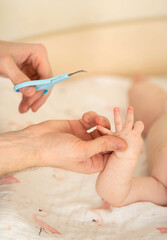 Obraz na płótnie Canvas The baby's fingernails are trimmed. Hygiene for babies.