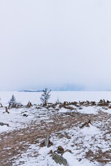 Pyramids of stones in winter on Lake Baikal.