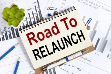 Road To Relaunch. Text on white notepad paper on light background.