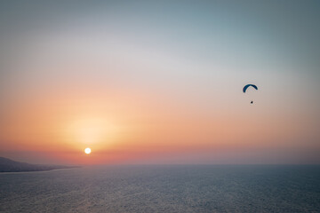 Parachuting - Paragliding in sunset