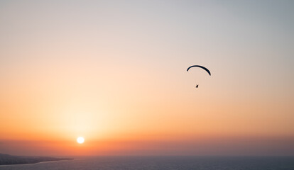 Parachuting - Paragliding in sunset