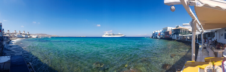 Panoramic view of a cruise ship from the promenade of mykonos island