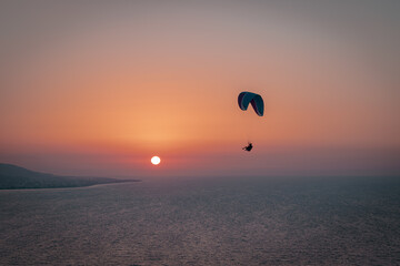 Parachuting - Paragliding in sunset