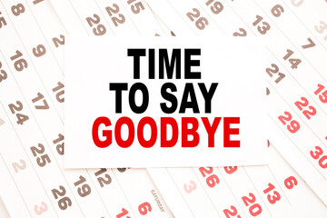 text TIME TO SAY GOODBYE on a sheet from Notepad.a digital background. business concept . business and Finance.