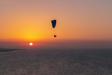 Parachuting - Paragliding in sunset