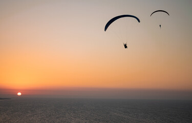 Parachuting - Paragliding in sunset