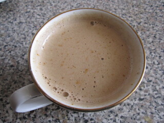 cup of cappuccino on granite table top