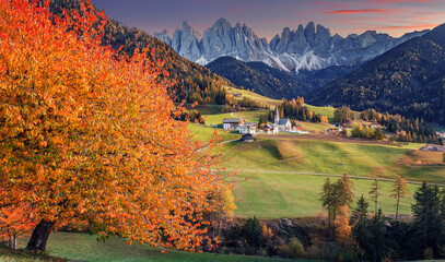Stunning alpine Landscape during sunset. Santa Maddalena one of the most popular photo spot of Dolomite. Famous World place. Dolomites Alps. Italy. Amazing Nature background. Vivid landscape in fall © jenyateua