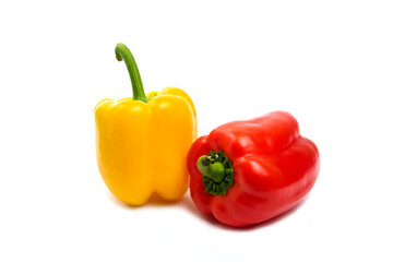 Red and yellow ripe bell peppers isolated on white background