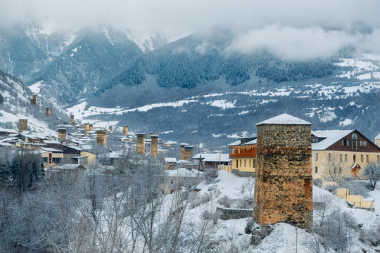 Beautiful scenery of Svan towers covered with snow - Mestia in winter, Georgia