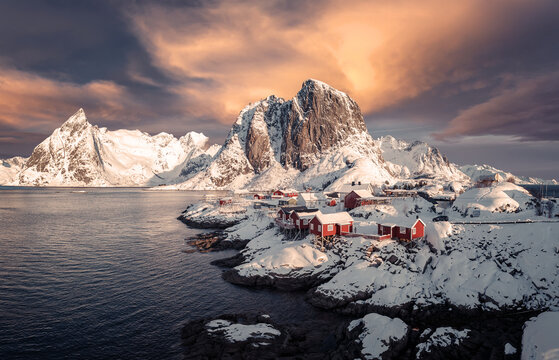Wonderful winter nature scenery. Stunning image north fjord with snowcapped mountains and colorful sky during sunset. Popular locations of northern Norway. Amazing Lofoten islands. nature background.
