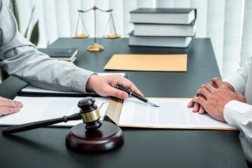 Male lawyer discussing negotiation legal case with client meeting with document contact in courtroom, law and justice concept