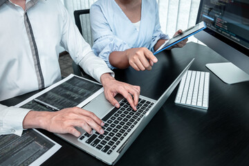 Team of Programmer working in software javascript computer in IT office, Writing codes and data...
