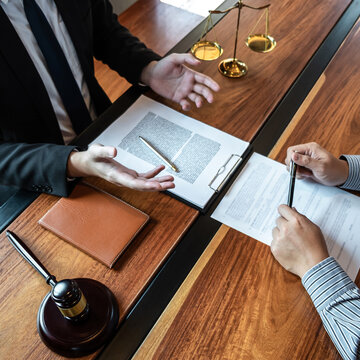 Professional Male Lawyer Or Counselor Discussing Negotiation Legal Case With Client Meeting With Document Contract In Office, Law And Justice, Attorney, Lawsuit Concept