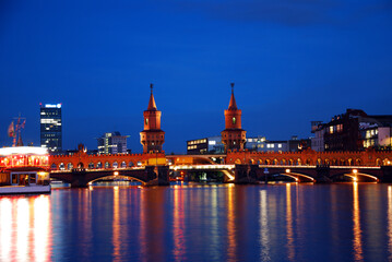 berlin oberbaumbruecke bridge by night with vibrant colors and long time exposure