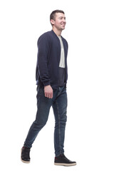 Fototapeta premium young man in jeans striding forward . isolated on a white