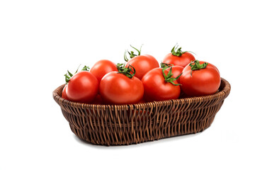 A wicker basket full of fresh juicy red tomatoes on white background