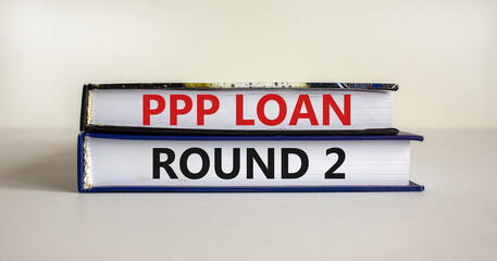 PPP, paycheck protection program loan round 2 symbol. Concept words PPP, paycheck protection program loan round 2 on books on a white background. Business, PPP loan round 2 concept.