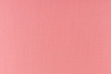 flat surface of salmon-colored fabric for sewing clothes, background, texture