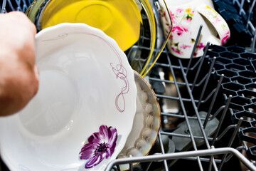 Fototapeta na wymiar Clean dishes after washing in the dishwasher.