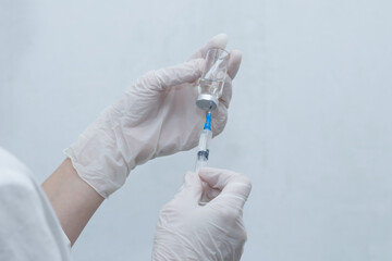 the nurse with a vaccine on a white background