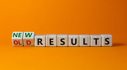 New vs old results symbol. Turned wooden cubes and changed words 'old results' to 'new results'. Beautiful orange background. Business, new or old results concept. Copy space.
