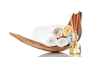 Wooden Bowl With Different Towels And Aroma Fragrance Dispensers As Wellness And Care Cut Out From White