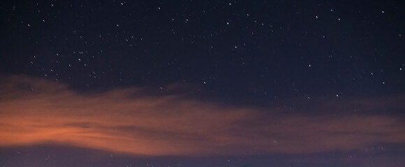 Starry sky with clouds. Night sky background.  