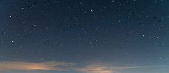 Fototapeta na wymiar Starry sky with clouds. Night sky background. 