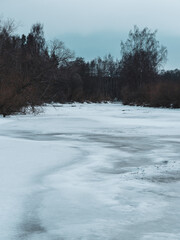 Lenaelva River at Toten, Norway, by Sundvika Nature Reservation in winter.