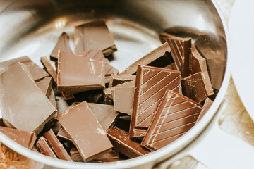 melted dark chocolate. Pieces of chocolate are melted to the state of chocolate sauce