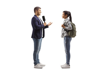 Male reporter with a microphone talking to a female student