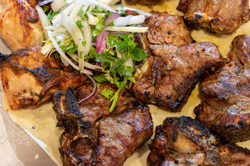 Grilled meat shashlik with spice. The Caucasian shish kebab. Juicy grilled beef on a plate