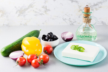 Fresh ingredients for homemade Greek salad on the table. Domestic life