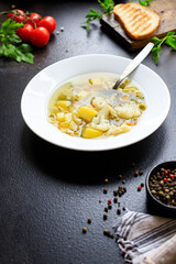 soup vegetable first course meal broth, potatoe, cauliflower, pasta no meat vegetarian or vegan portion on the table snack top view copy space food background