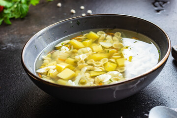soup vegetable first course meal broth, potatoe, cauliflower, pasta no meat vegetarian or vegan portion on the table snack top view copy space food background